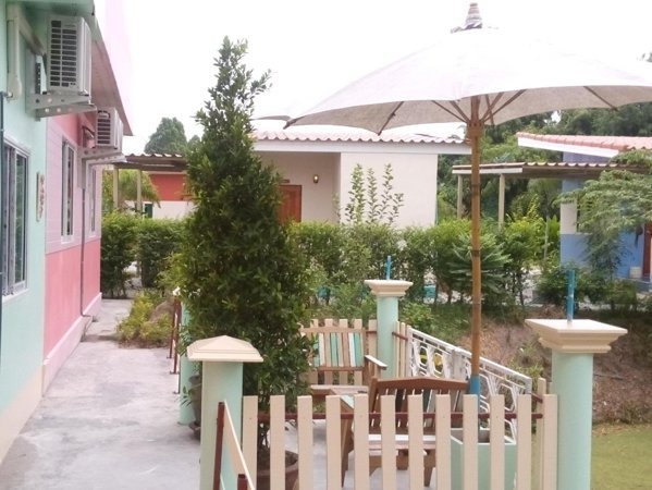 Garden seating beside accommodation at Baan Rim Taan