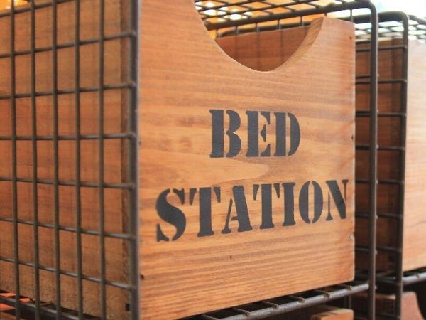 Hanging entrance sign at BED STATION Hostel Ratchathewi
