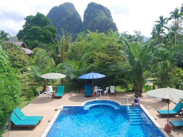 Swimming pool and mountain backdrop at Hotel Khao Sok and Spa
