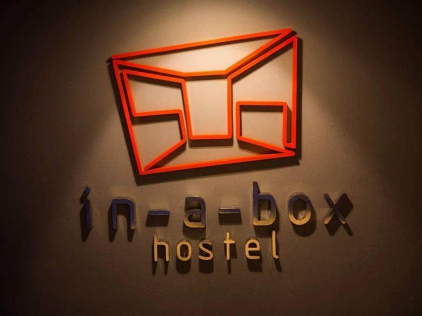 In a Box Hostel wall sign