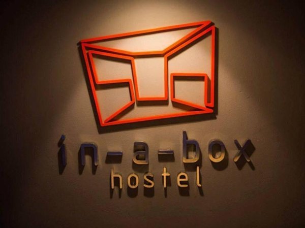 In a Box Hostel wall sign
